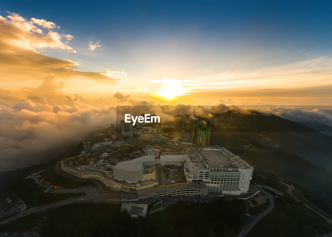 High angle view of buildings against sky during sunset