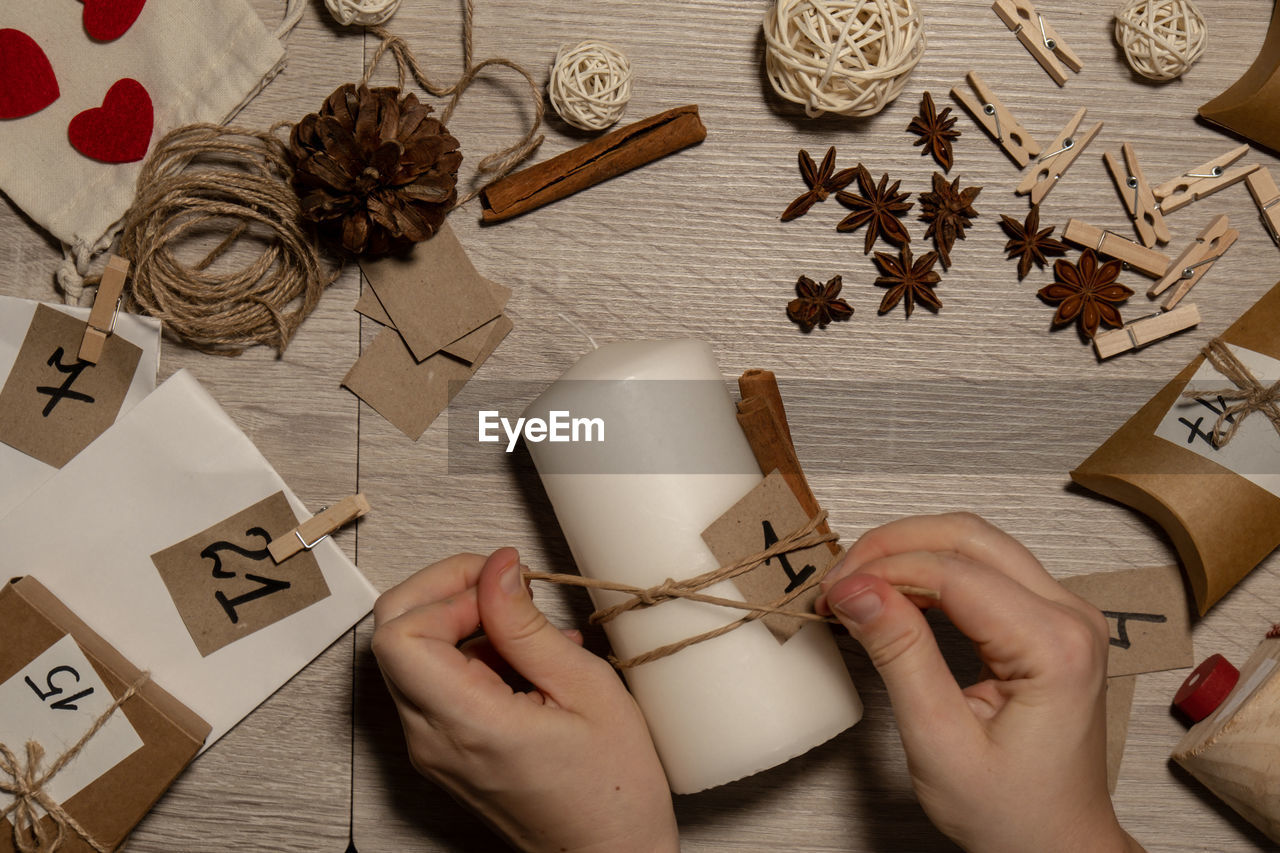 cropped hand of woman holding christmas decoration