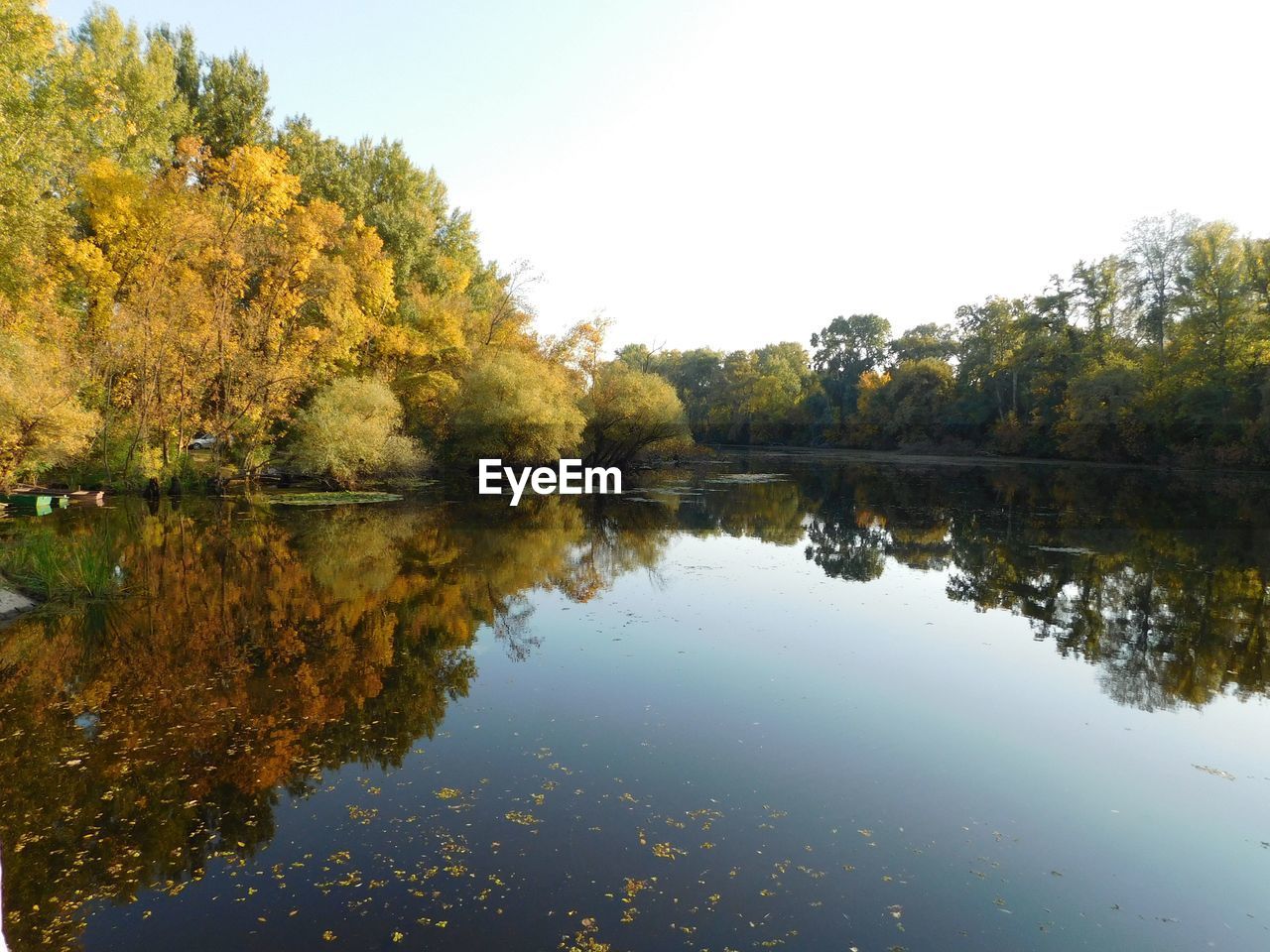 Reflection of trees in lake against sky during autumn