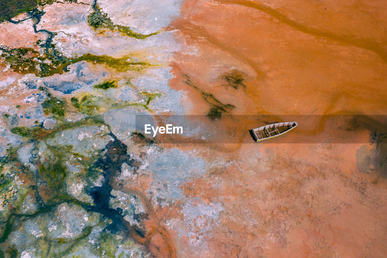 HIGH ANGLE VIEW OF OLD ABANDONED ON ROCK