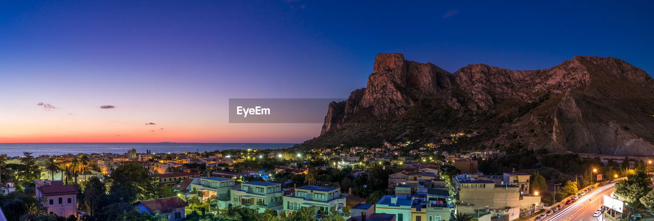 High angle view of city by mountain