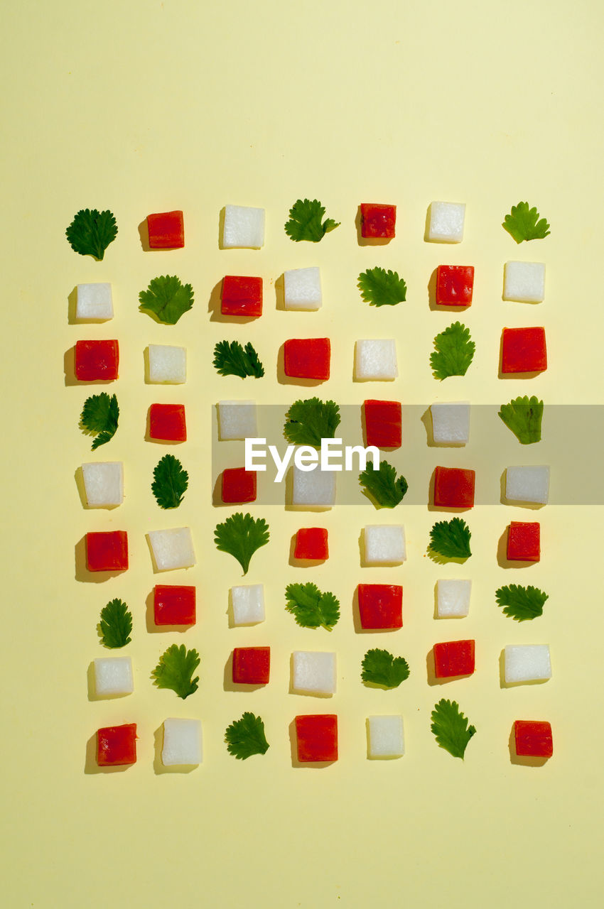 High angle view of food arranged on yellow background