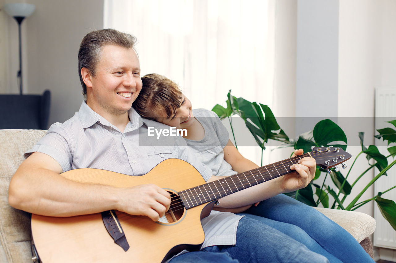 young man playing guitar