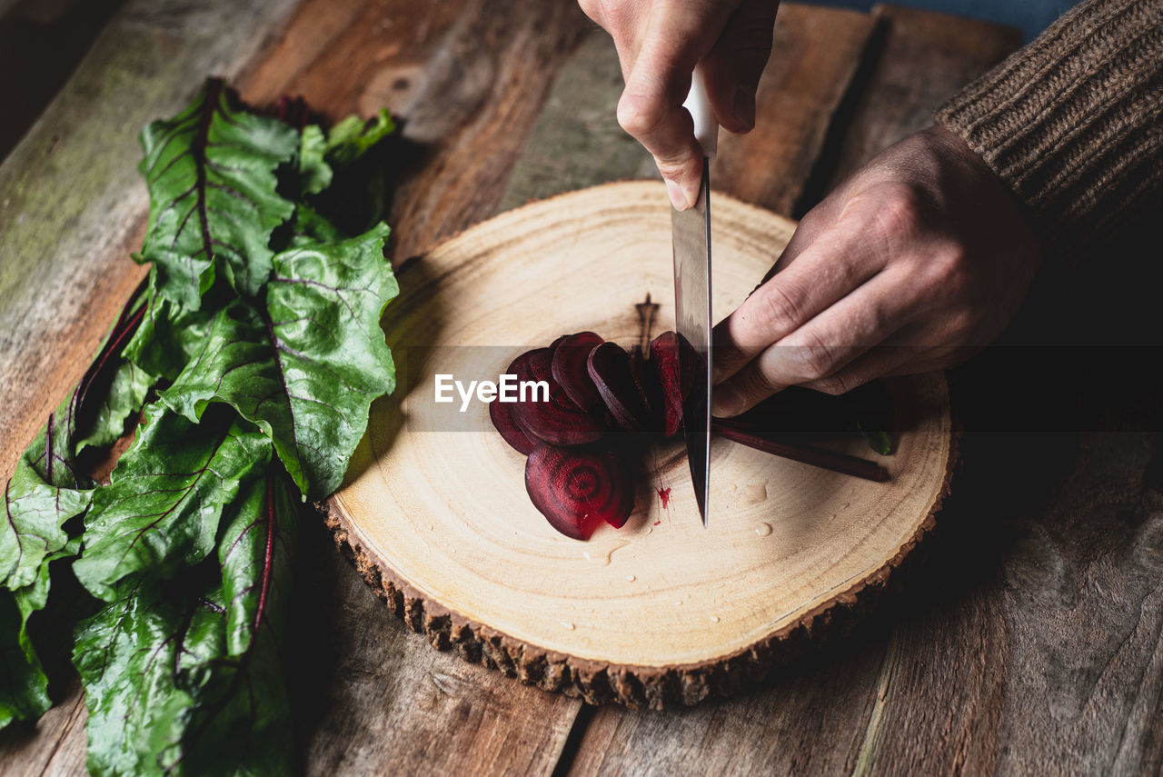 MIDSECTION OF PERSON PREPARING FOOD