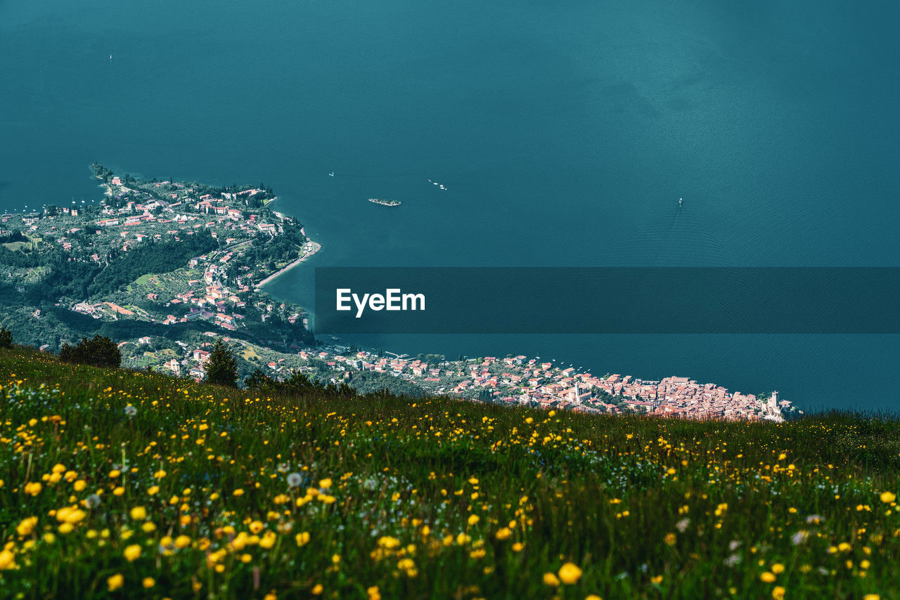 Panoramic view from monte baldo on the old town of malcesine and lake garda in italy.