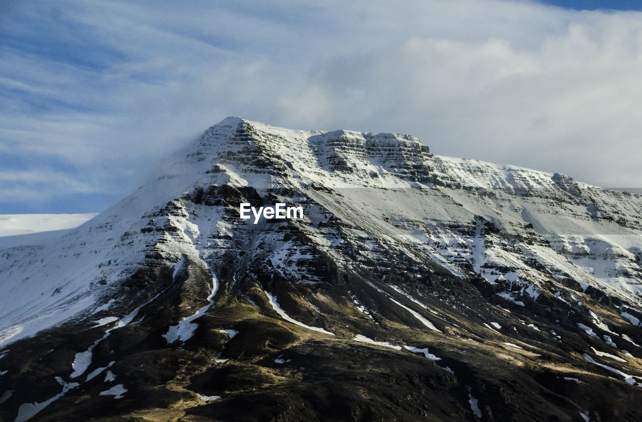 SNOWCAPPED MOUNTAINS AGAINST SKY