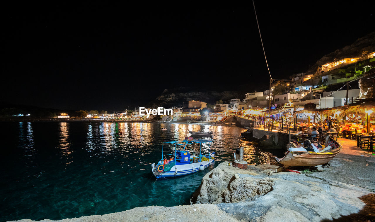 illuminated buildings in city at night