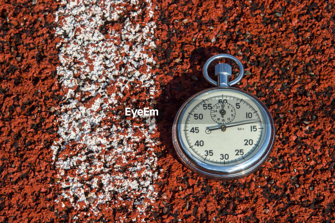 Close-up of stopwatch on field