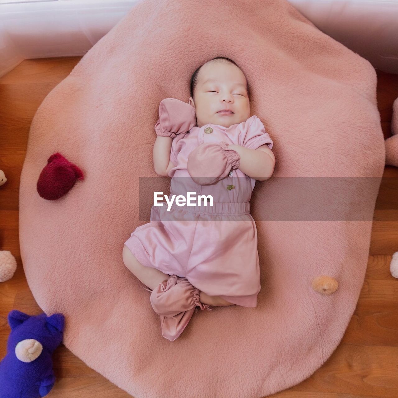 high angle view of cute baby boy lying on bed
