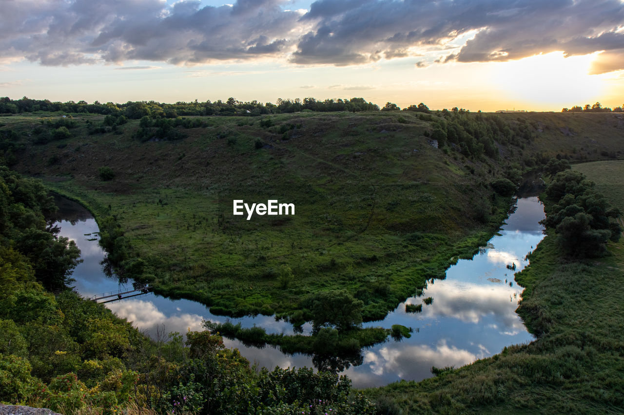 Scenic view of landscape against sky during sunset