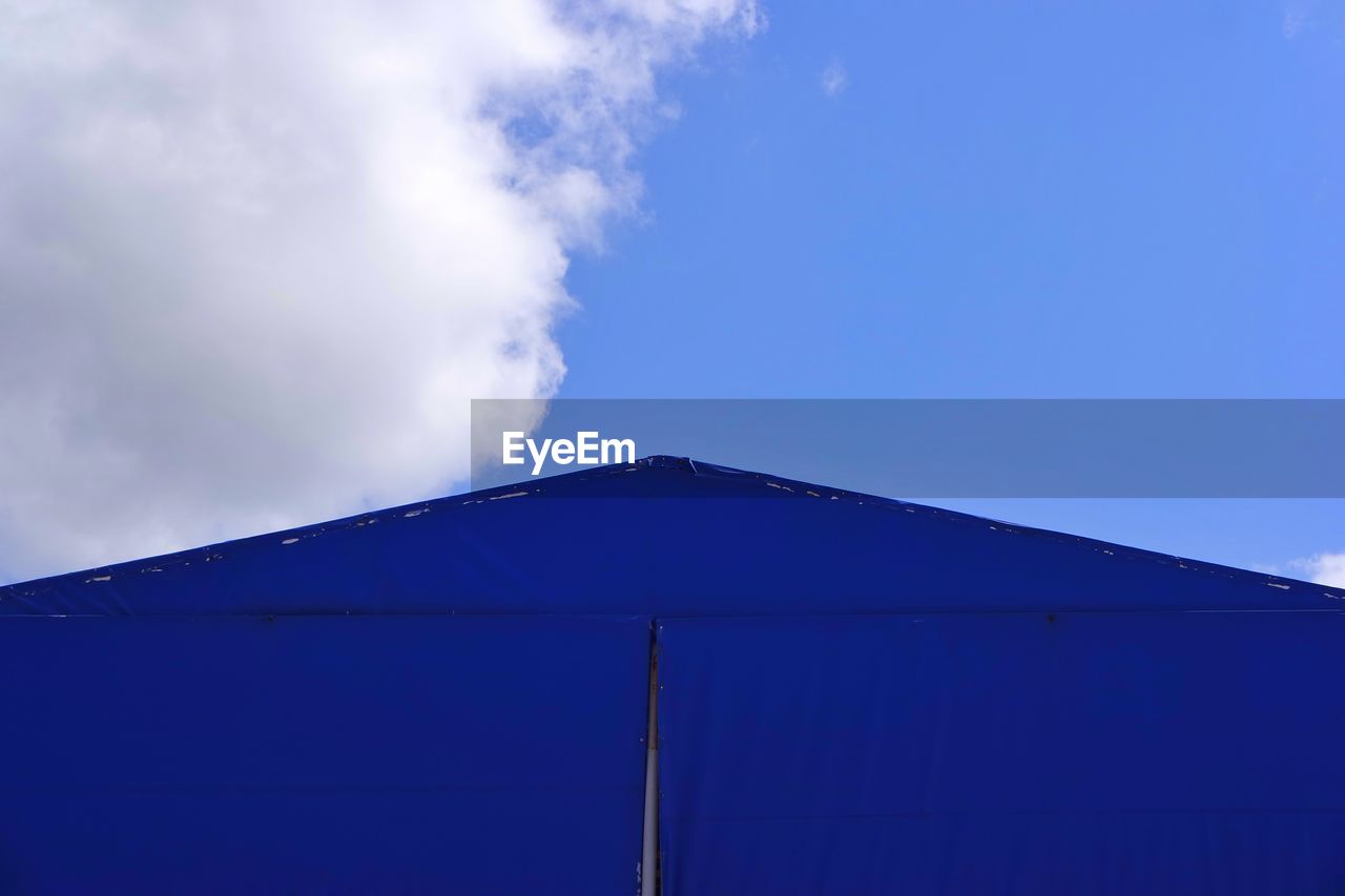 Low angle view of built structure against blue sky