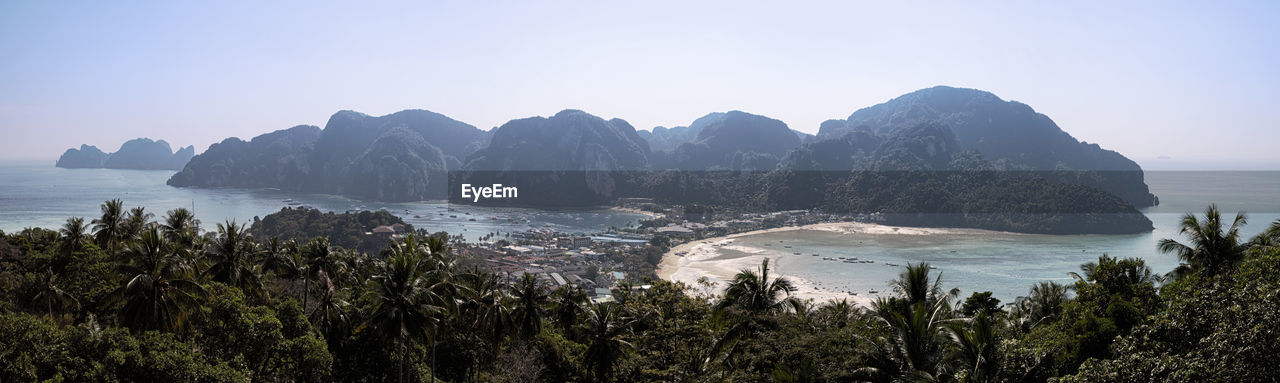 PANORAMIC SHOT OF SEA AND MOUNTAINS AGAINST CLEAR SKY