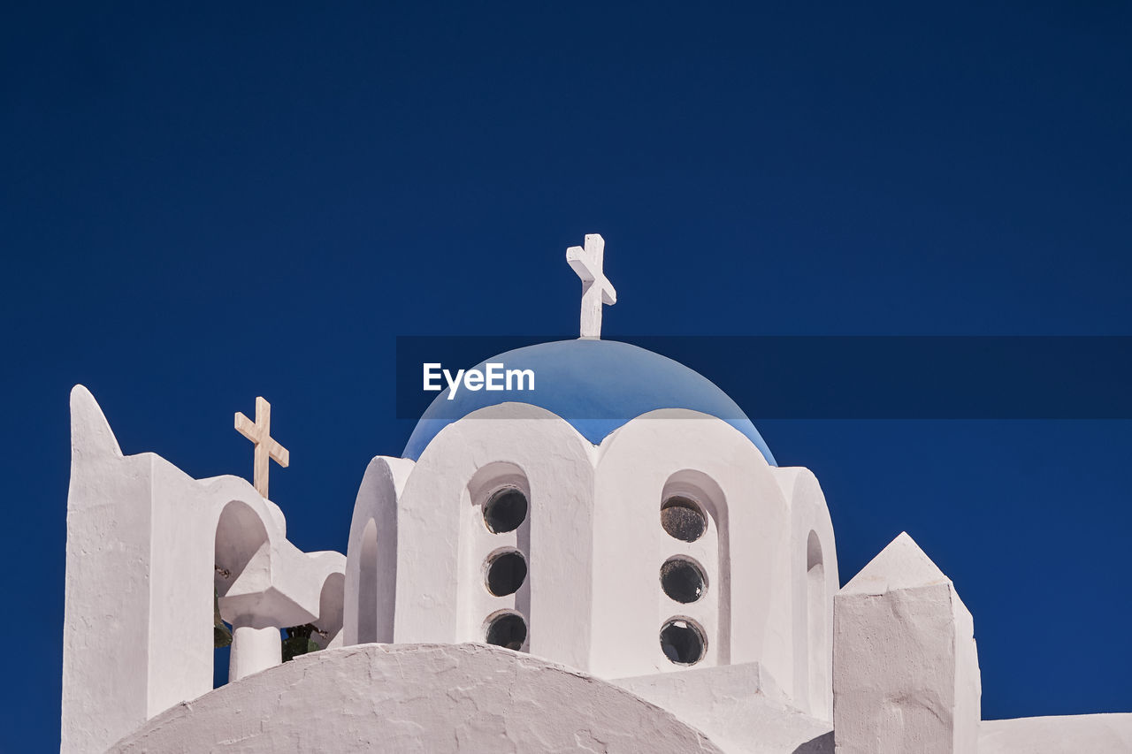 Saint ierotheos holy chapel - blue dome and bell tower - pyrgos village, santorini island, greece