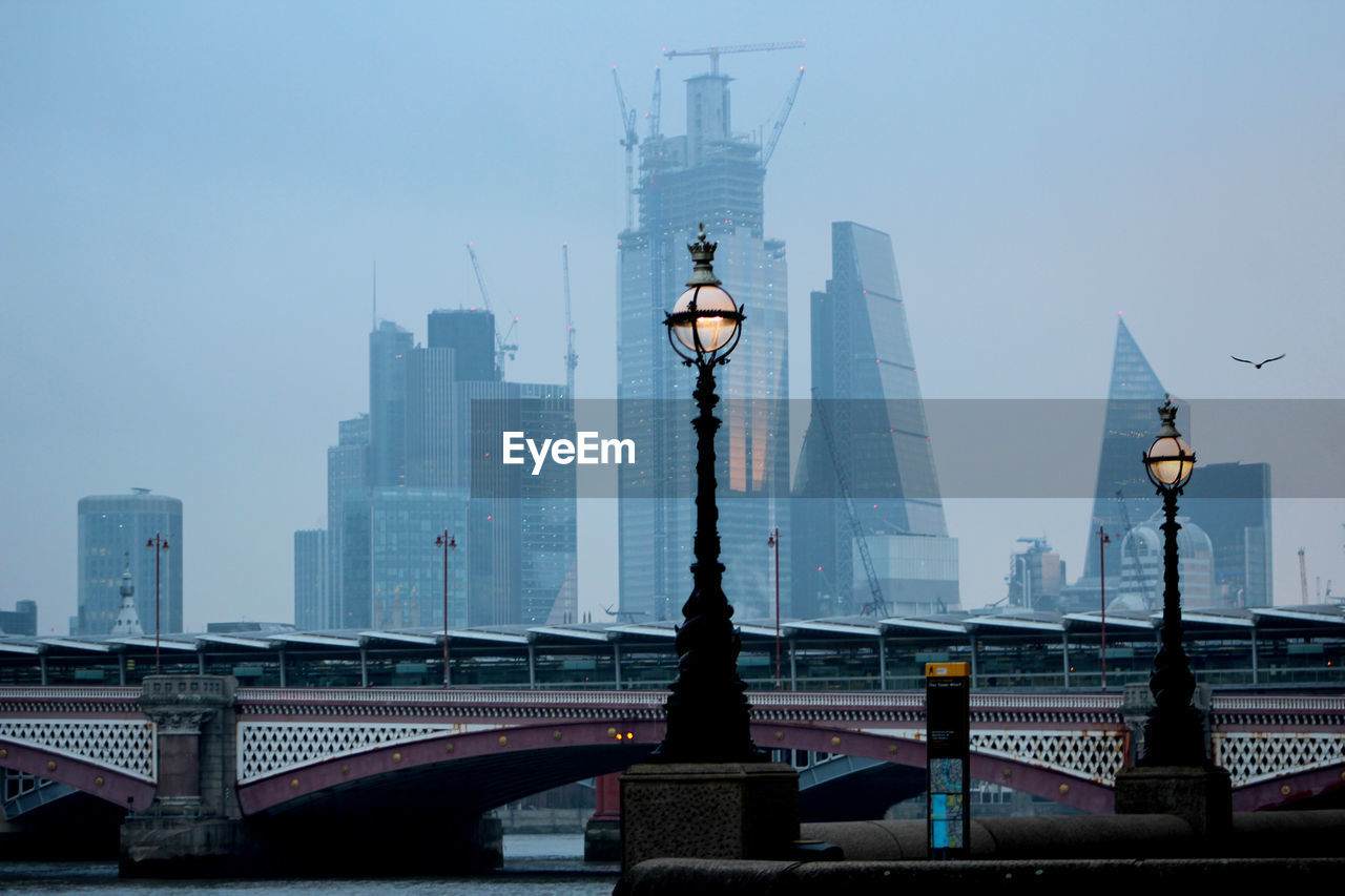 Modern buildings in city against sky