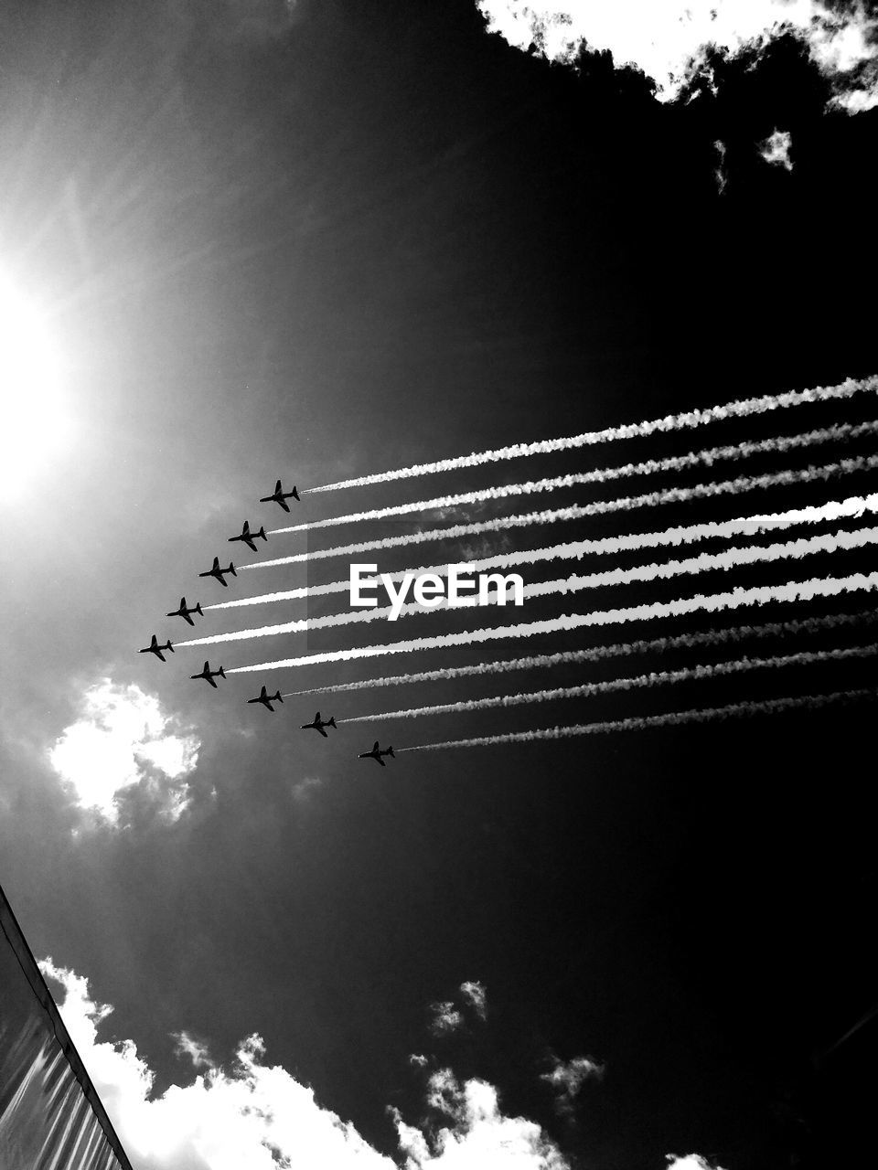 LOW ANGLE VIEW OF SILHOUETTE AIRSHOW AGAINST SKY