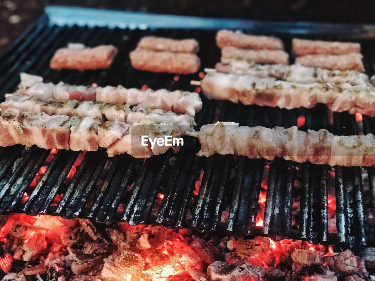 CLOSE-UP OF MEAT ON BARBECUE