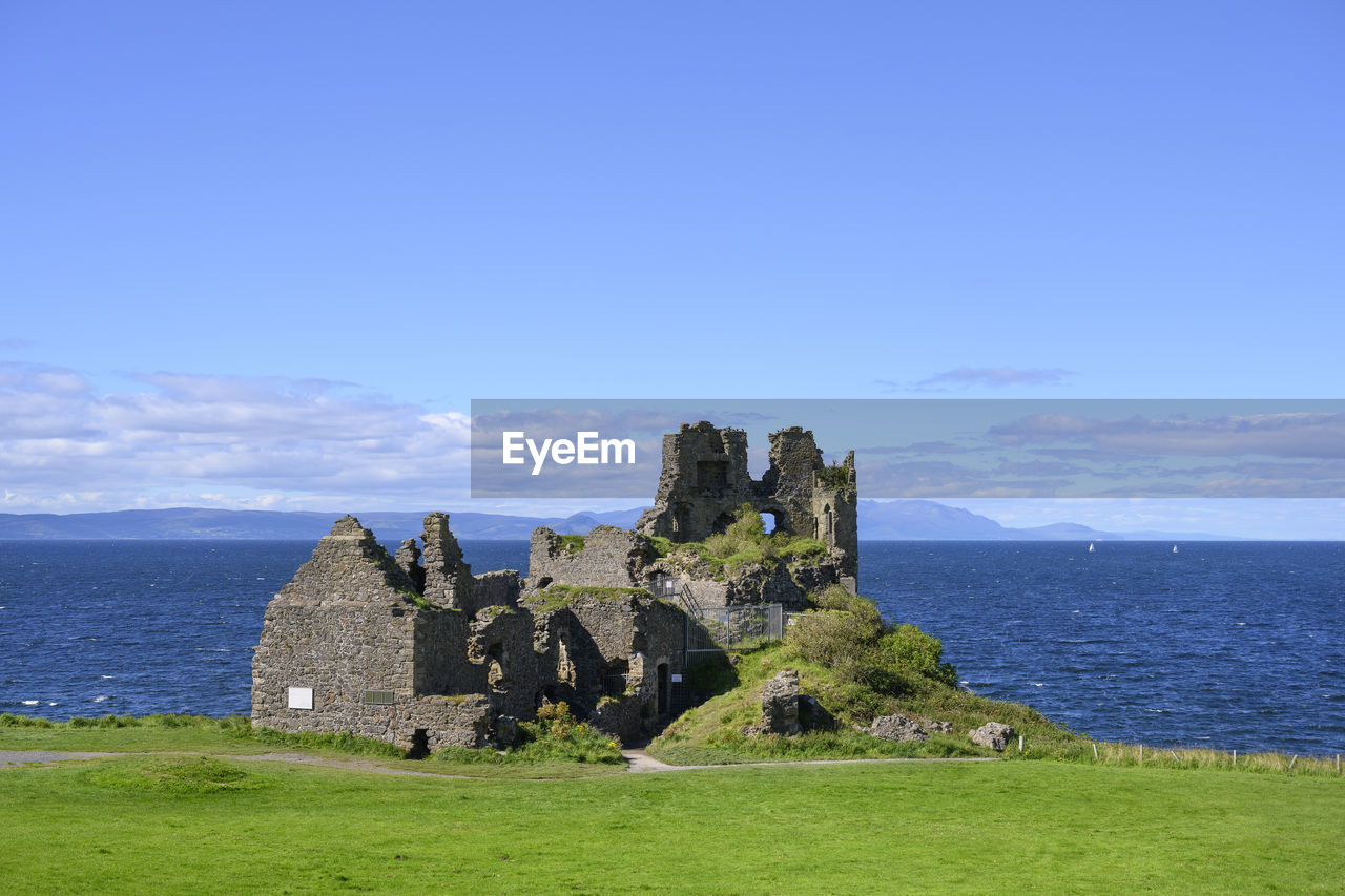 Uk, scotland, ruins of dunure castle with irish sea in background