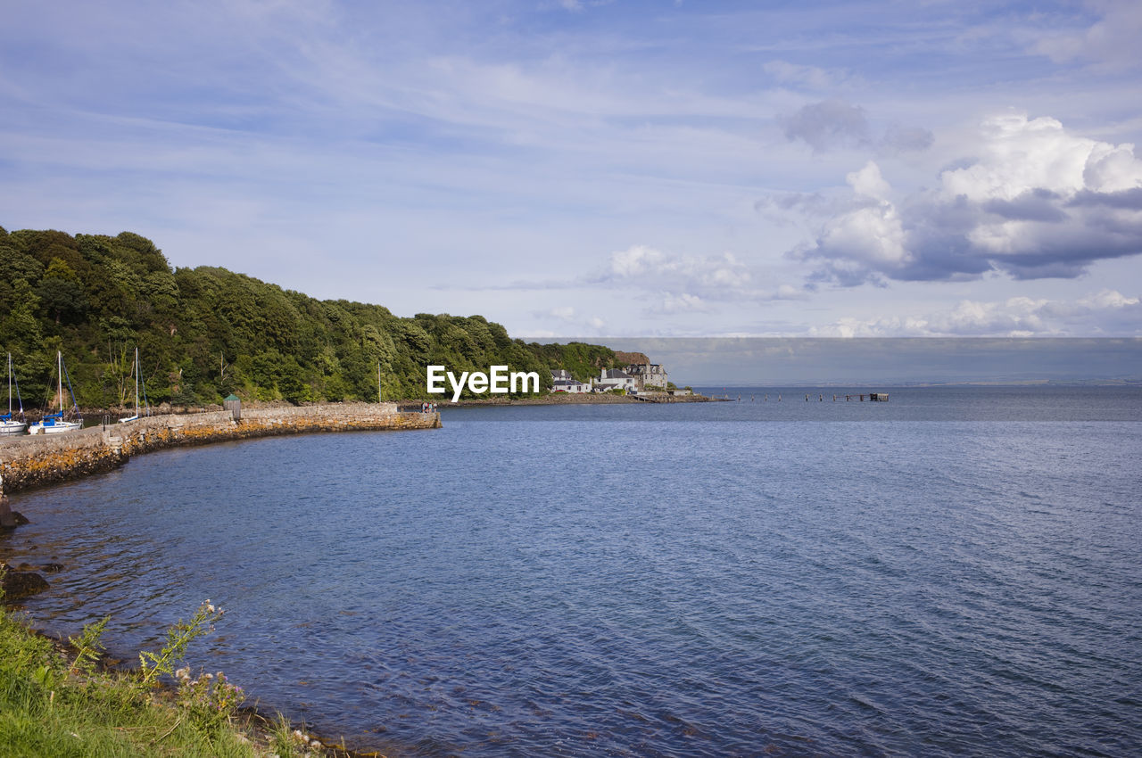 water, sky, sea, body of water, land, cloud, shore, scenics - nature, beauty in nature, beach, nature, tranquility, coast, plant, travel destinations, tree, tranquil scene, travel, environment, reservoir, landscape, coastline, tourism, island, no people, trip, vacation, holiday, bay, idyllic, blue, outdoors, day, architecture, non-urban scene, horizon, ocean, reflection, lagoon, seascape, summer, nautical vessel, horizon over water