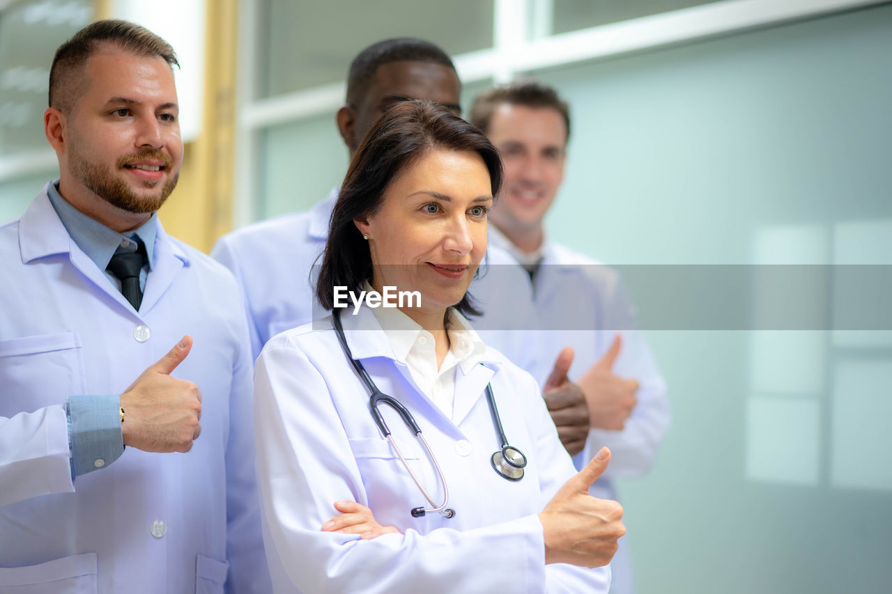 portrait of doctor examining patient in clinic