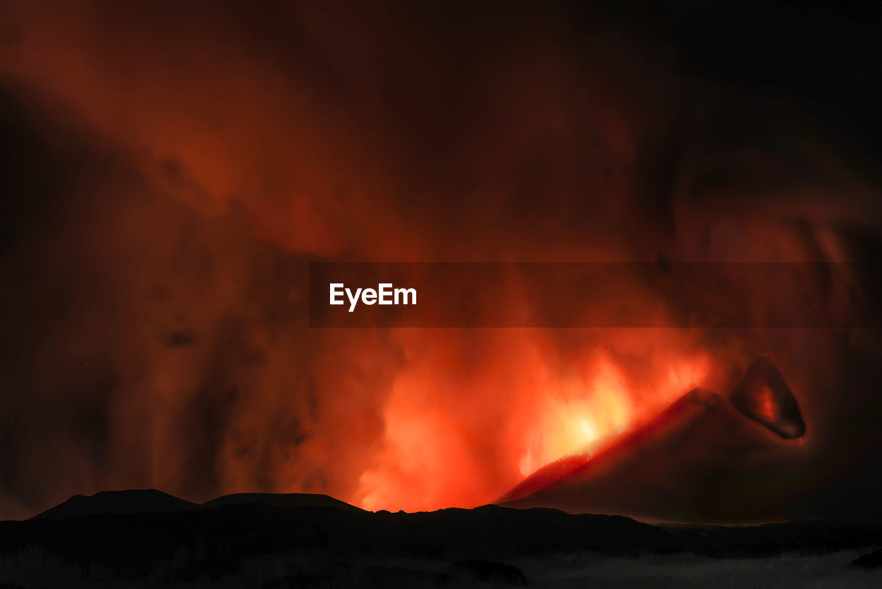 lava, mountain, volcano, geology, heat, erupting, sign, smoke, warning sign, power in nature, nature, land, active volcano, communication, environment, beauty in nature, night, no people, burning, landscape, fire, accidents and disasters, motion, glowing, outdoors, non-urban scene, molten, physical geography, volcanic crater, flame