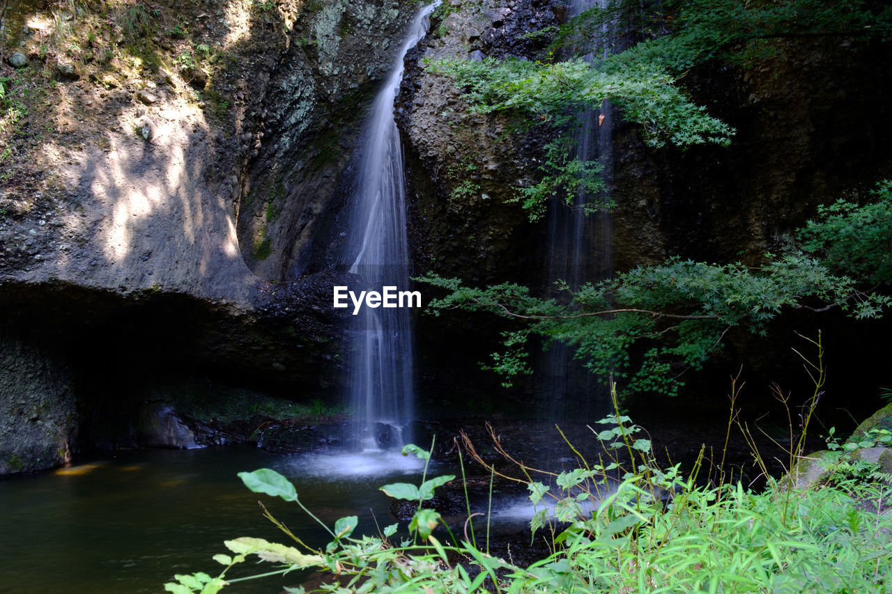 SCENIC VIEW OF WATERFALL