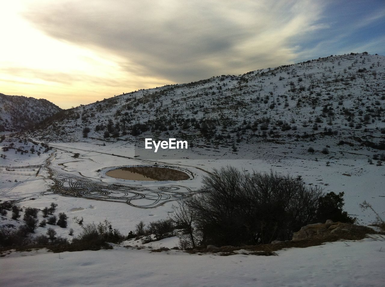 Scenic view of snow covered mountains against sky