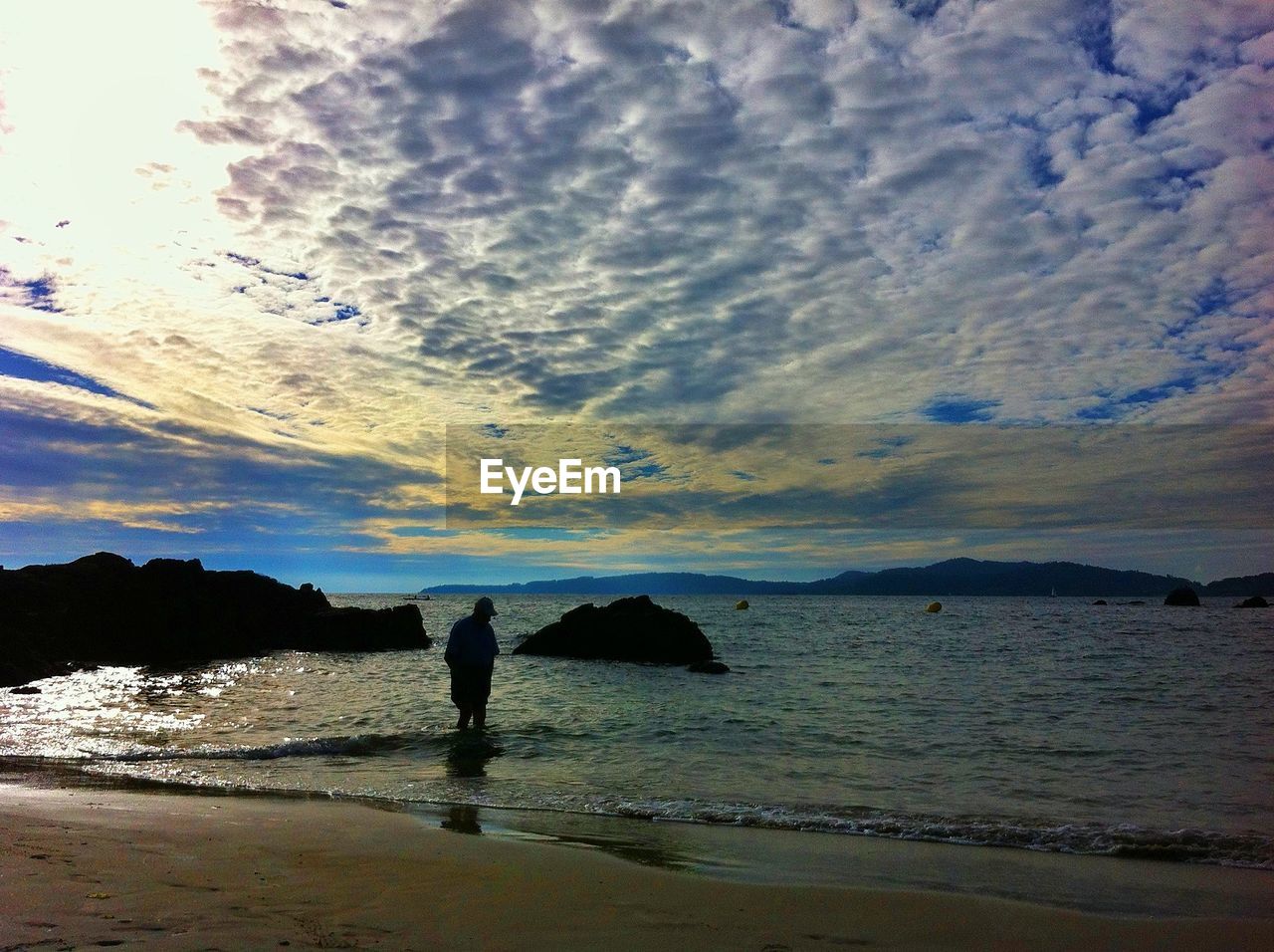 SILHOUETTE OF PEOPLE ON BEACH