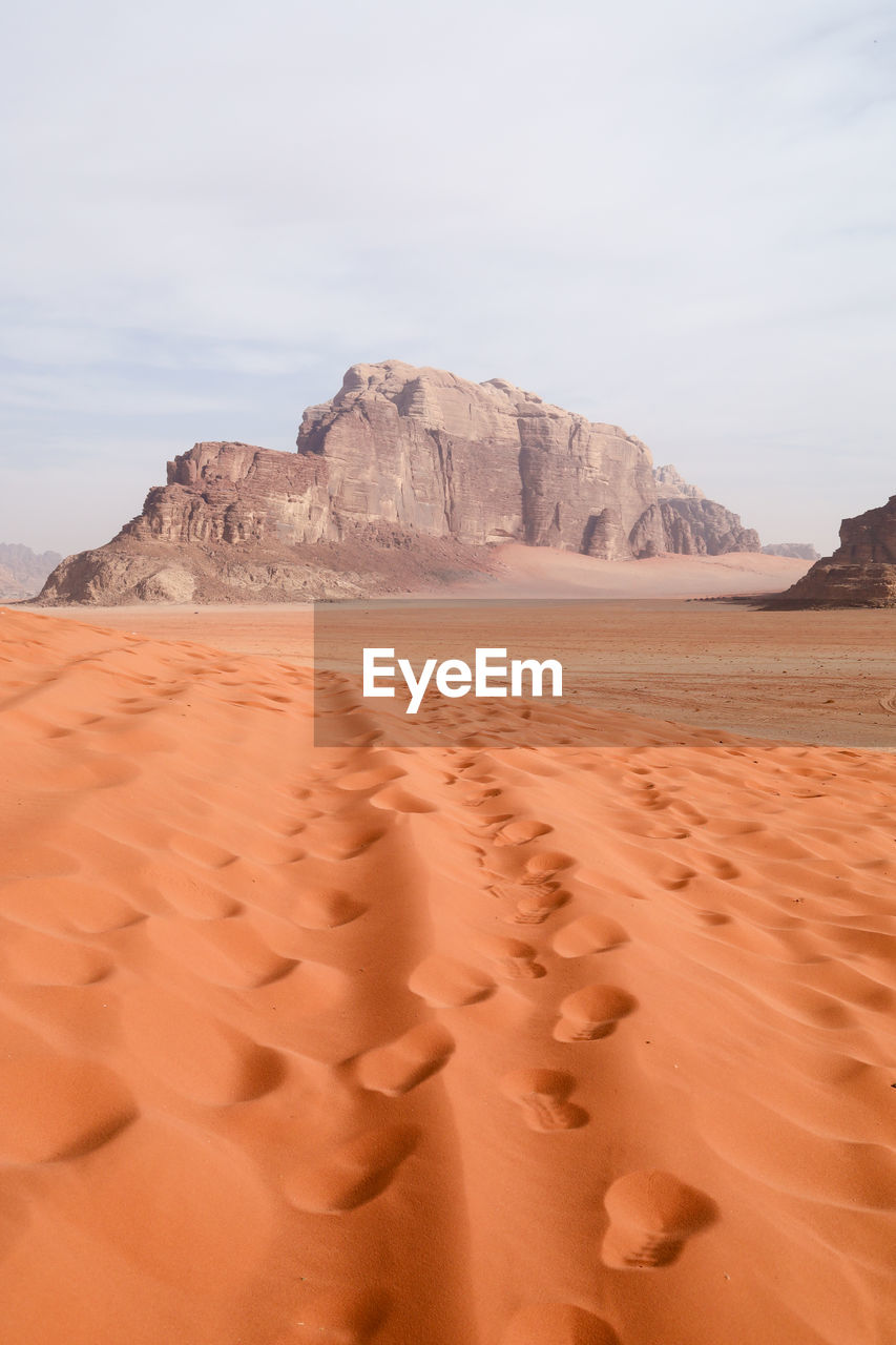 Sand dunes in wadi rum desert against sky