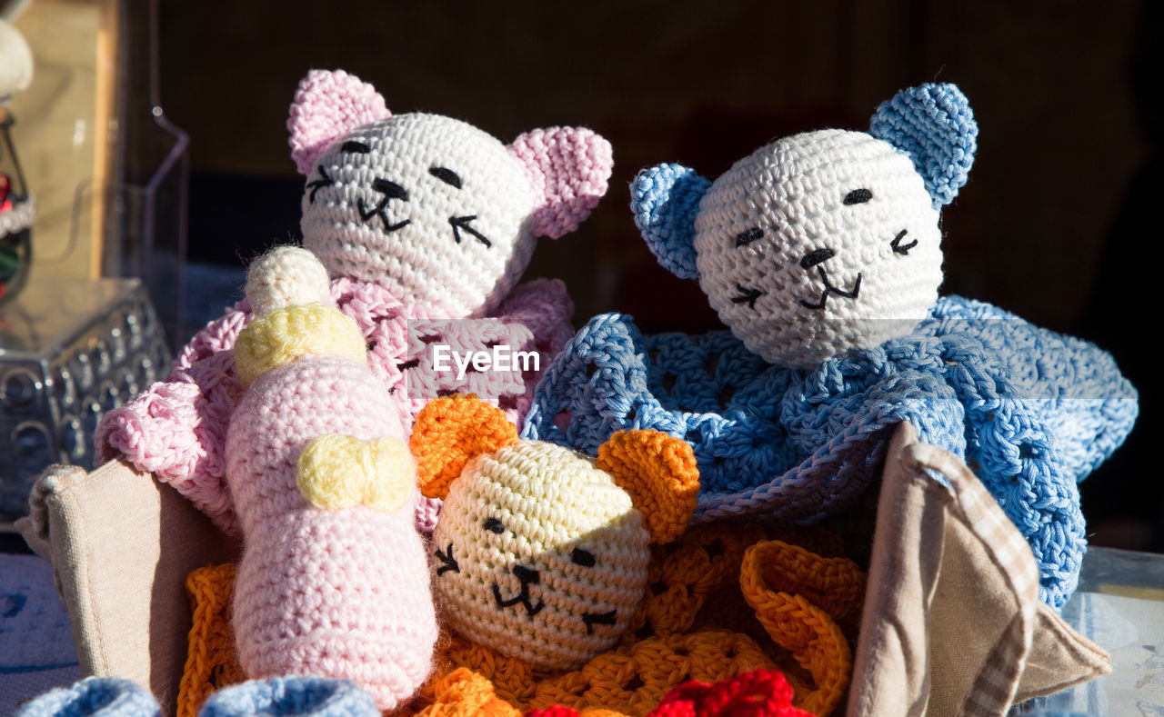 Close-up of knitted toys outdoors