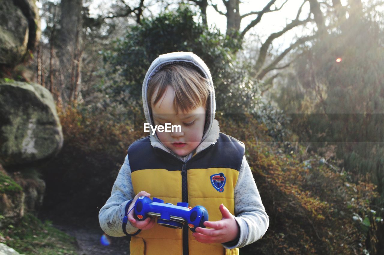 Boy playing with remote control