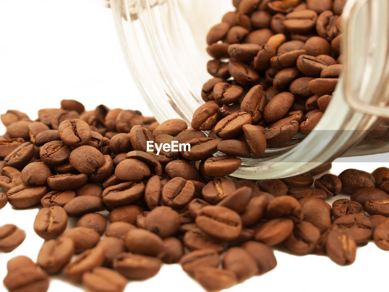 Close-up of coffee beans against white background