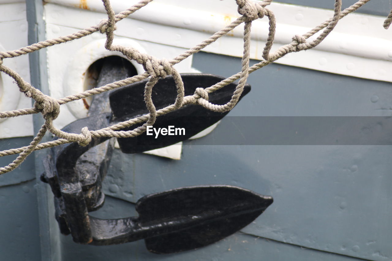 Close-up of rope against boat anchor at st katharine docks