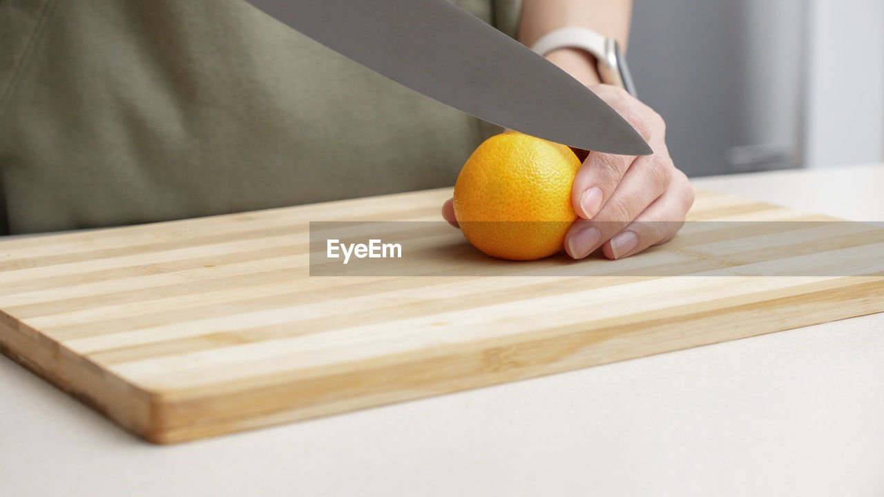 high angle view of sliced oranges on cutting board