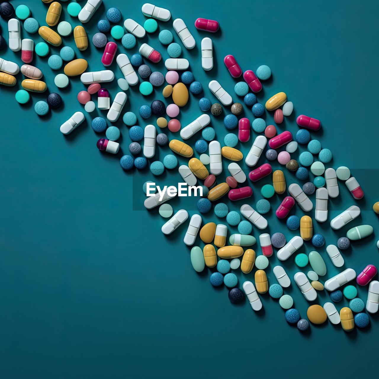 Top view of pills spilling over blue background.copy space.healthcare medicine concept.ai generated