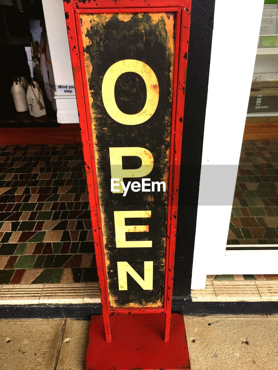 High angle view of open sign outside of cafe