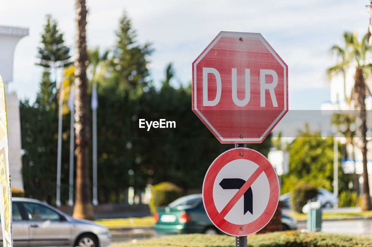 close-up of road sign against sky