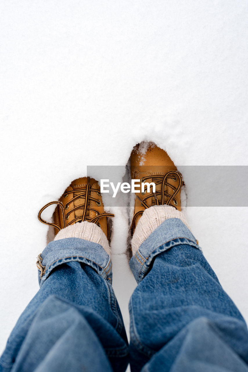 Boots in the snow, top view.