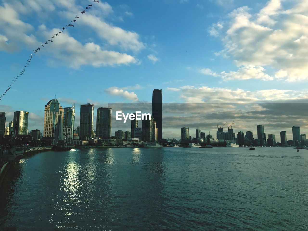 SEA BY MODERN CITY SKYLINE