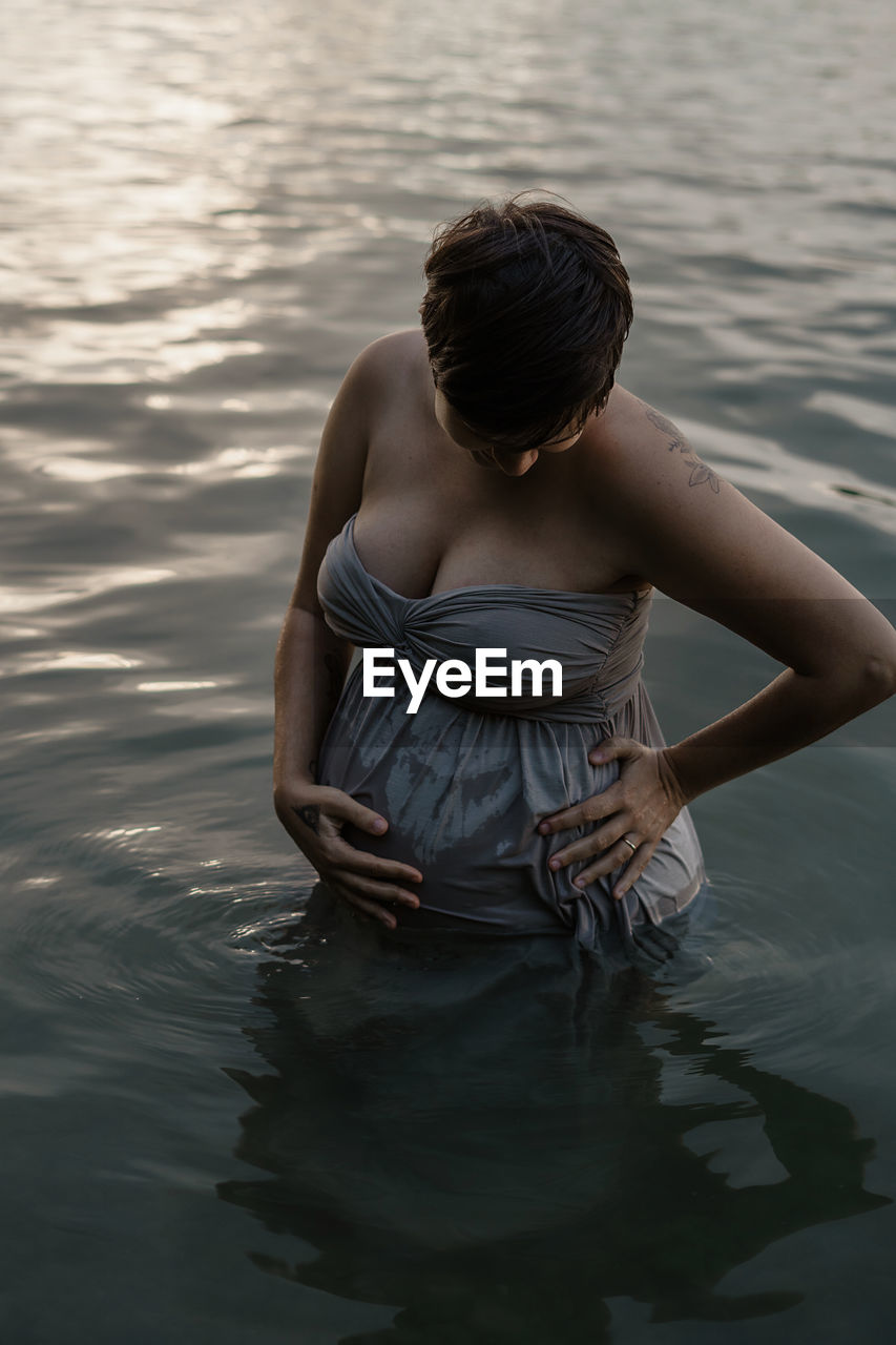 Pregnant woman in lake