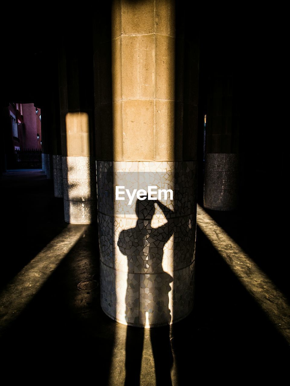High angle view of person shadow on architectural column
