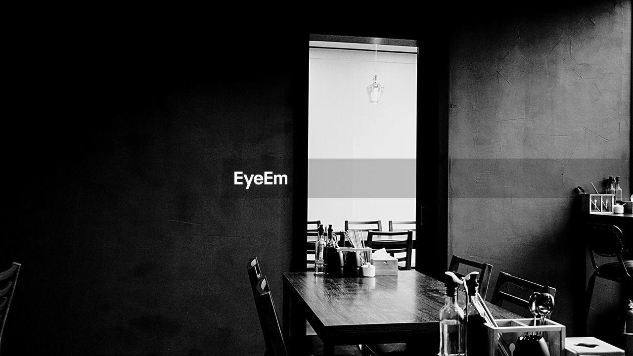 Empty table and chairs in restaurant