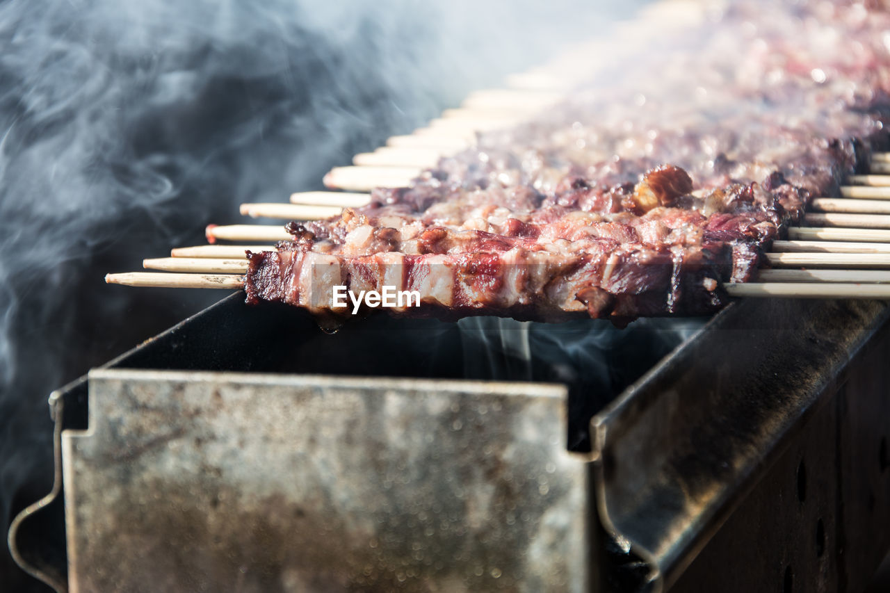 Close-up of italian meat on barbecue grill outdoor 