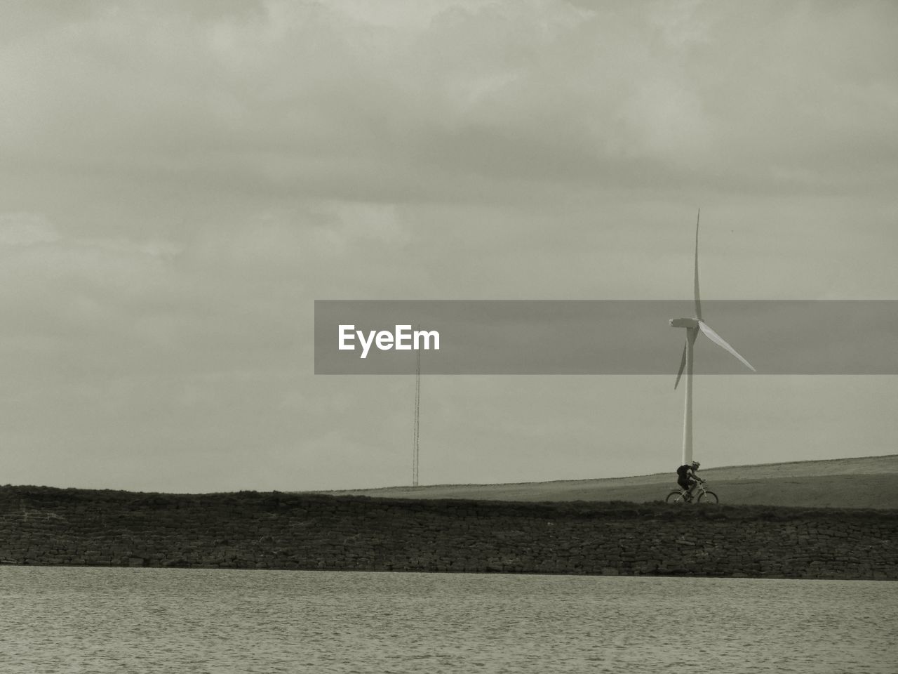 Wind turbines on landscape against the sky