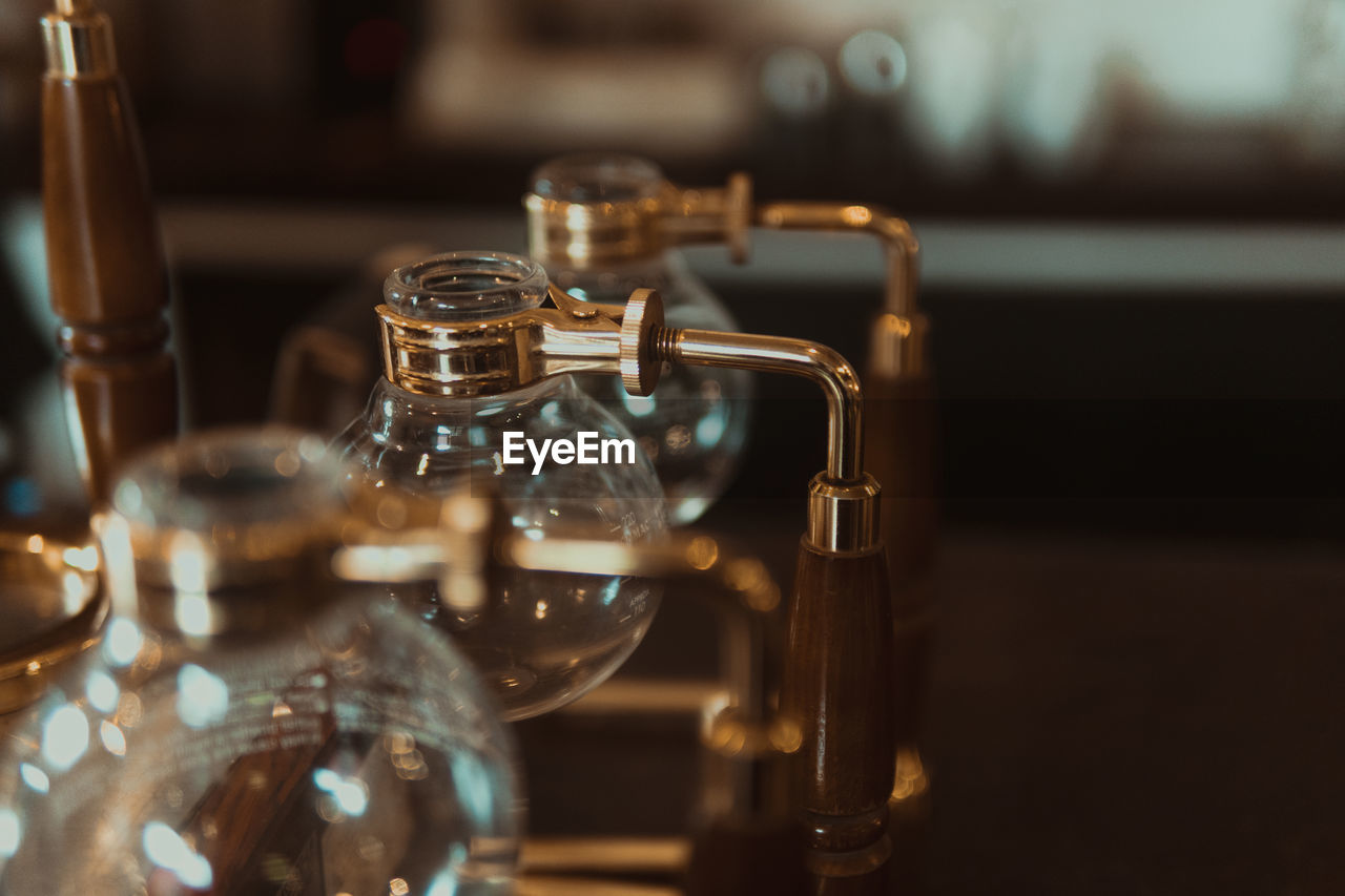 Close-up of empty glass containers on table