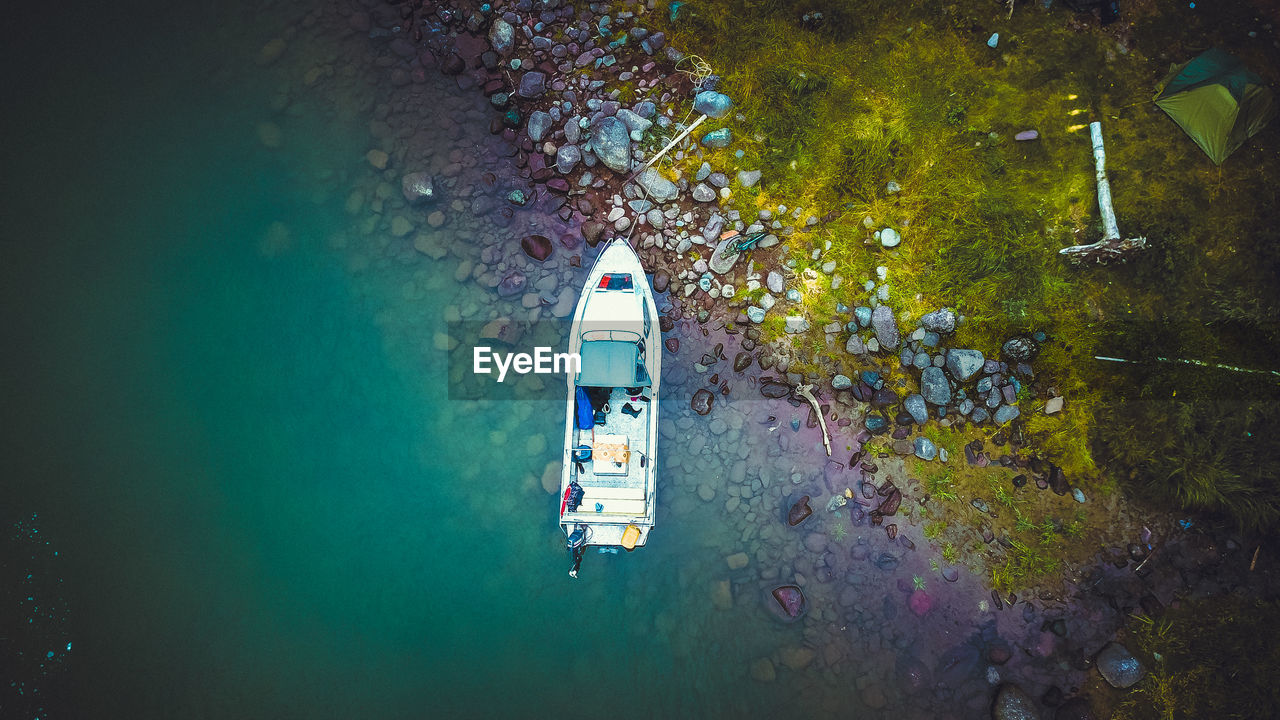 HIGH ANGLE VIEW OF NAUTICAL VESSEL ON SEA