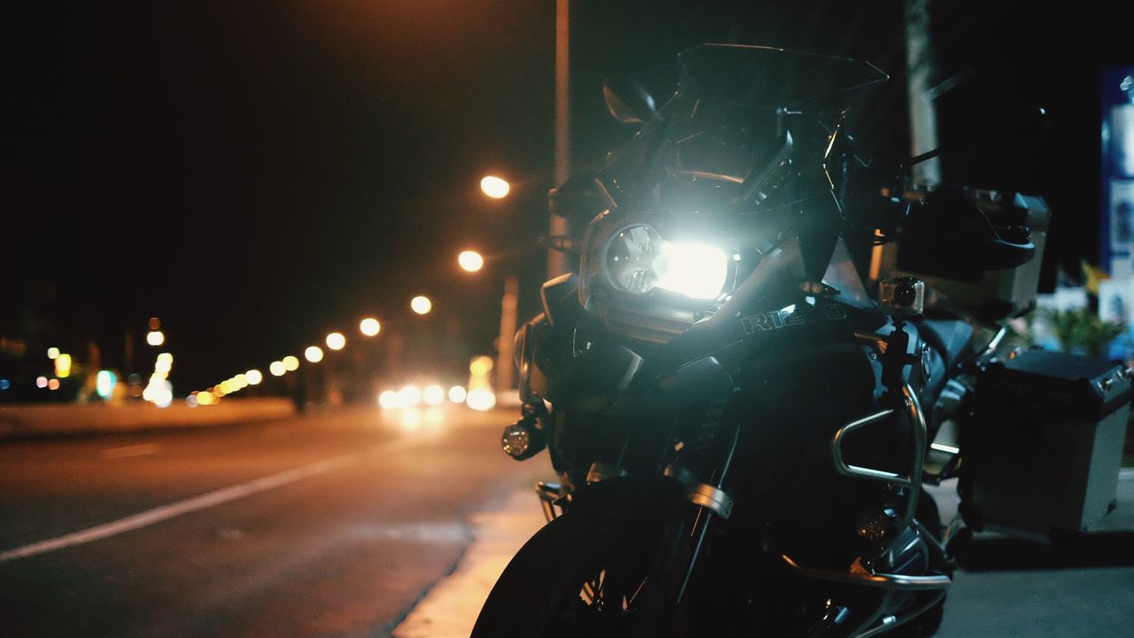 Motorcycle on road at night