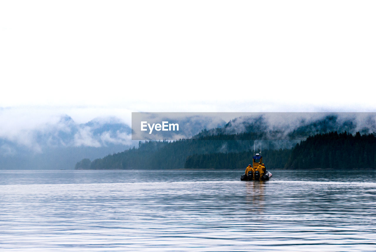 Boat on lake against clear sky