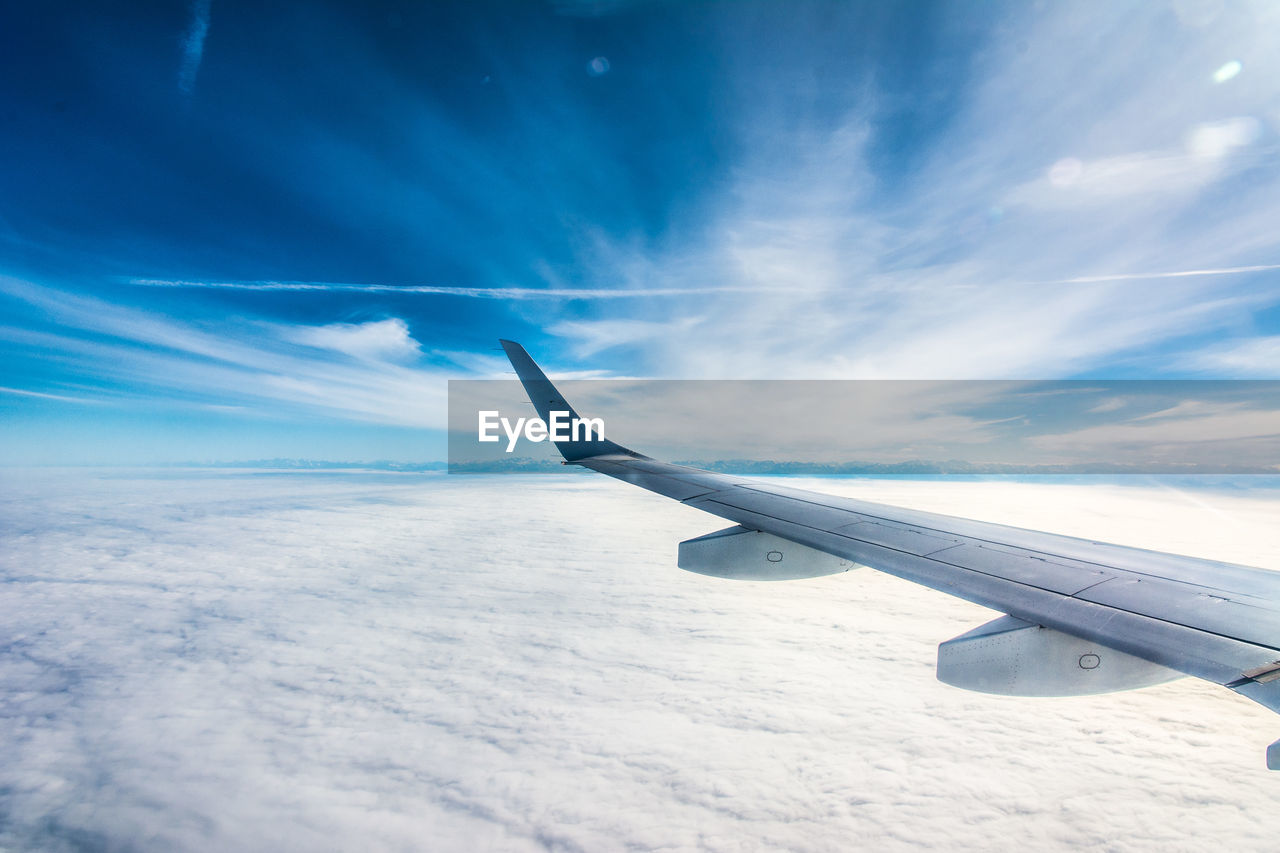 Airplane flying against sky