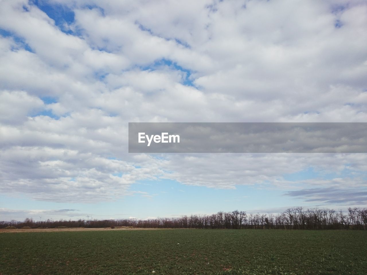 SCENIC VIEW OF LANDSCAPE AGAINST CLOUDY SKY