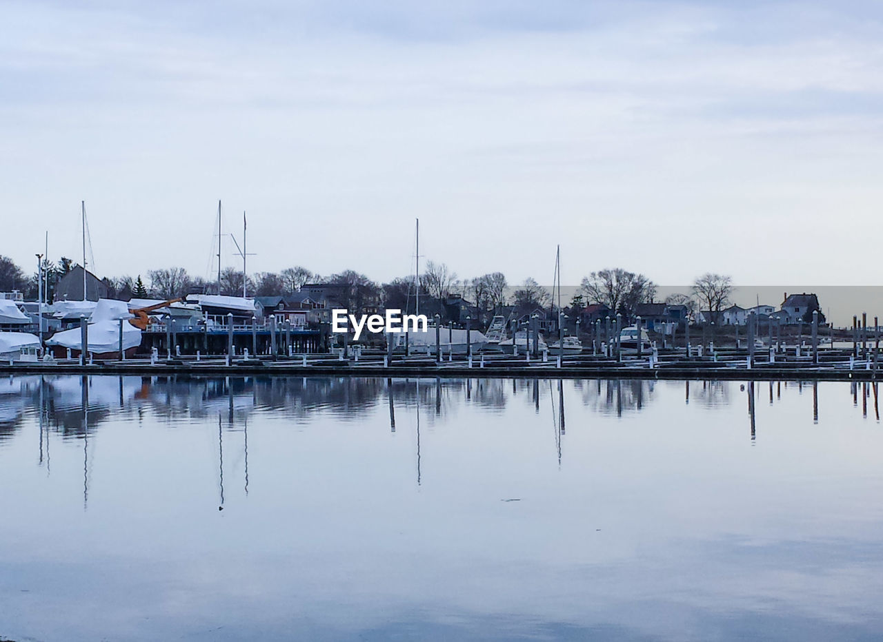 Boats moored at harbor